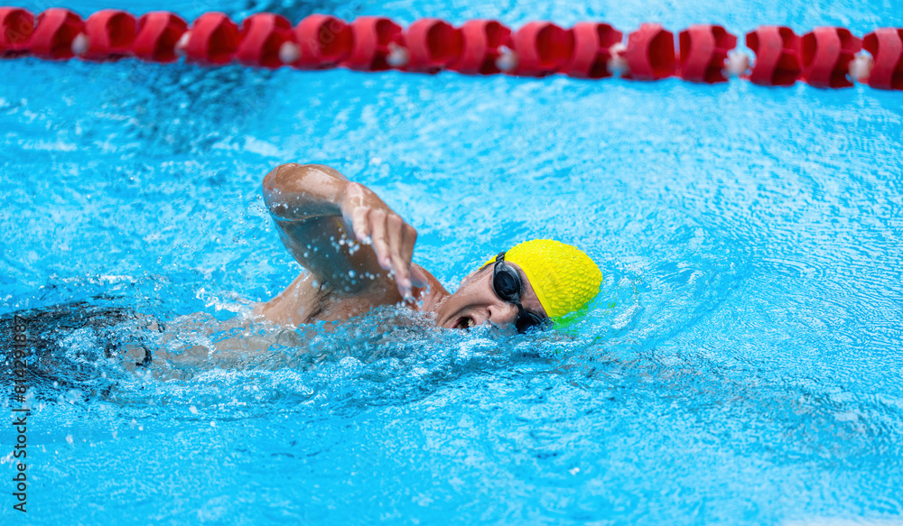 Asian male athlete swimming in the pool