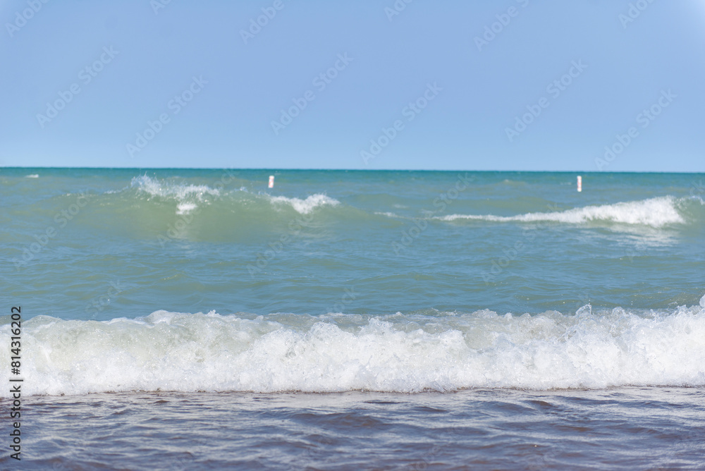 Beach near Lake Michigan. Rough waves. Two waves on the water. Beach near Lake Michigan. Rough waves. Two waves on the water.