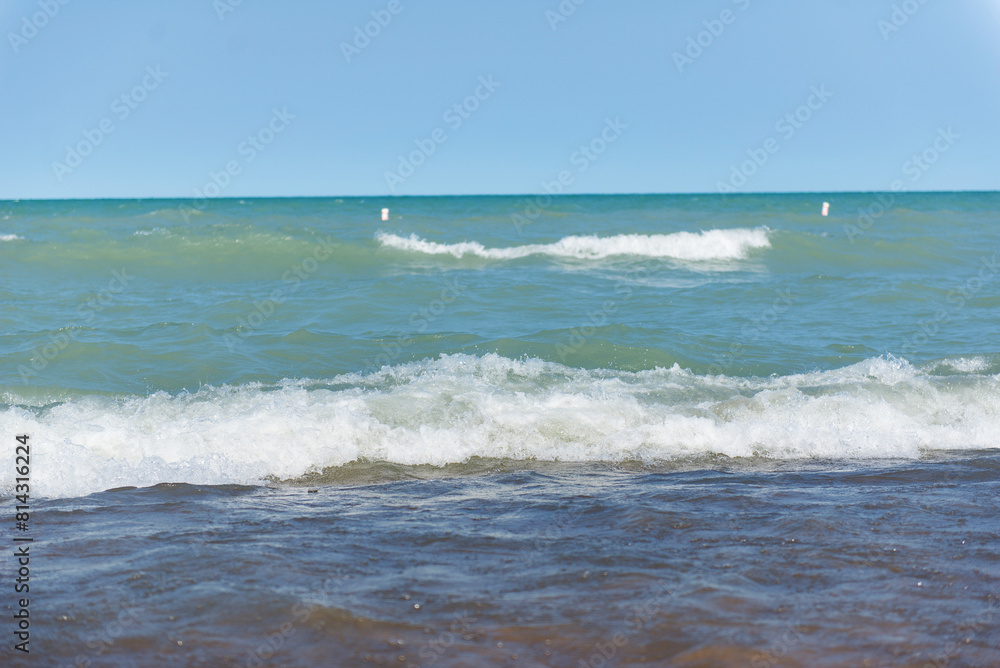 Beach near Lake Michigan. Rough waves. Two waves on the water. Beach near Lake Michigan. Rough waves. Two waves on the water.