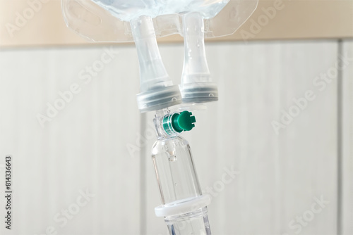 Intravenous drip of medicine hanging in room patient at the hospital.