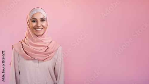 Happy woman. Optimistic emotion. Pleased satisfied confident smiling female face in headscarf isolated on pastel pink empty space background.