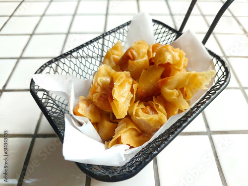 Mini fried wonton homemade snack served at the restaurant