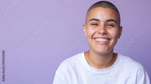 A woman with a shaved head is smiling, cancer patient with chemotherapy