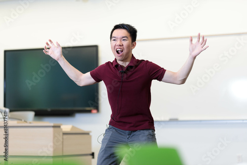 High school student drama class demonstration outstretched gestures happily