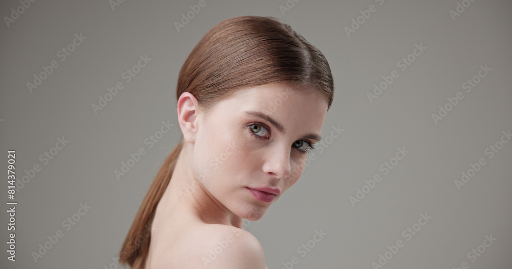 Beauty, health, cosmetics, anti-aging therapy and skin care concept - young beautiful brunette Caucasian woman posing and looking at the camera with a calm confident look Beauty, health, cosmetics, anti-aging therapy and skin care concept - young beautiful brunette Caucasian woman posing and looking at the camera with a calm confident look