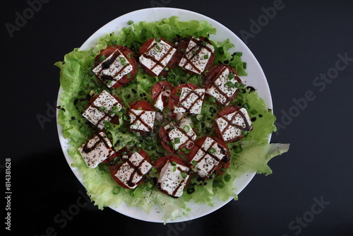 salad tomatoes cheese greens sauce seasonings