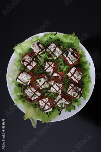 salad tomatoes cheese greens sauce seasonings