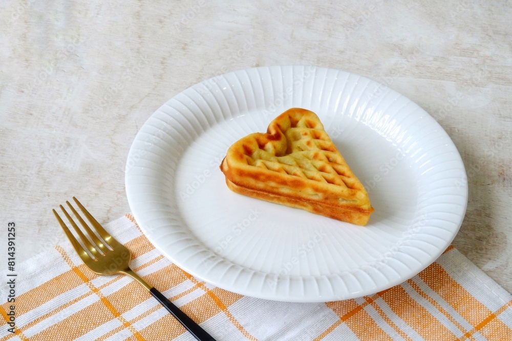 Heart shape of Plain Croissant Waffle or Croffle served in white plate Heart shape of Plain Croissant Waffle or Croffle served in white plate
