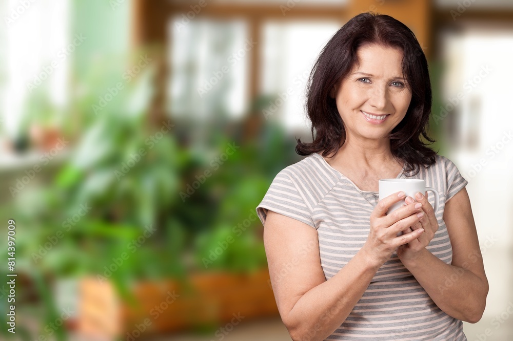 Beautiful young happy woman relaxing drinking hot tea Beautiful young happy woman relaxing drinking hot tea