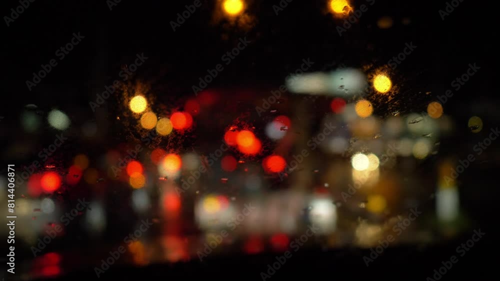raining while driving on road with traffic jam