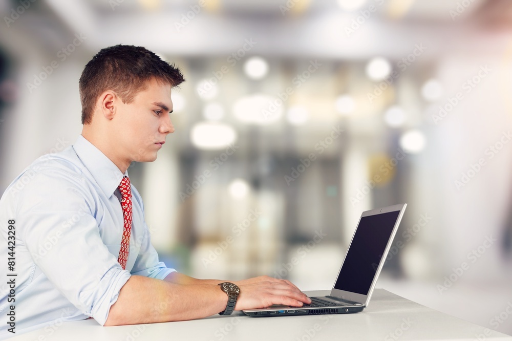 Smiling busy professional businessman work on laptop Smiling busy professional businessman work on laptop