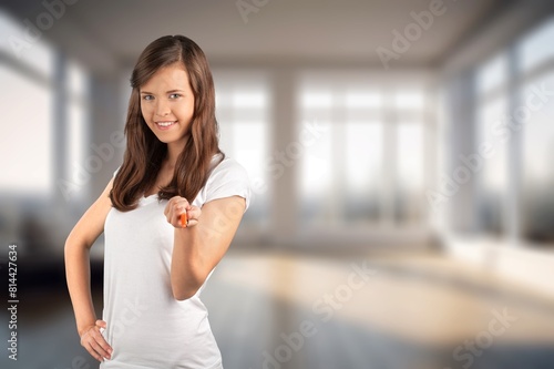 Free Download Young happy woman living alone posing in room - GFXLoad