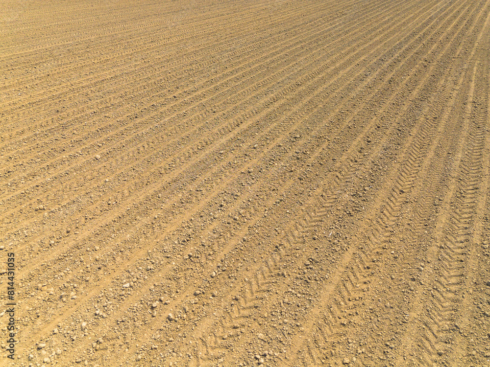 rows of plowed soil prepared for sowing rows of plowed soil prepared for sowing