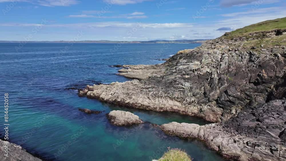 Beautiful West Cork sunny day coastal cliffs and calm blue ocean. Galley Head peninsula, Ireland Beautiful West Cork sunny day coastal cliffs and calm blue ocean. Galley Head peninsula, Ireland