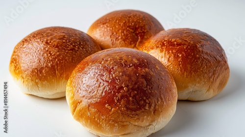 Close-up top view of soft potato buns, ideal for making burgers, emphasizing their tender and airy texture, isolated background