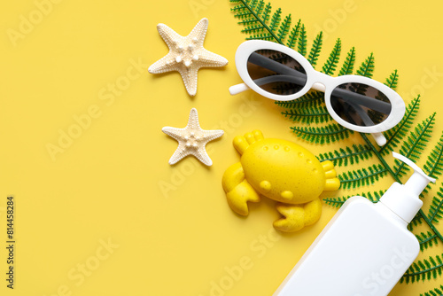 Top view of sunglasses,starfishs,beach toy and sunscreen and with copy space for text. Summer holiday concept
