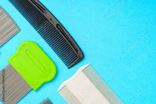 Comb for lice removing on blue background photo