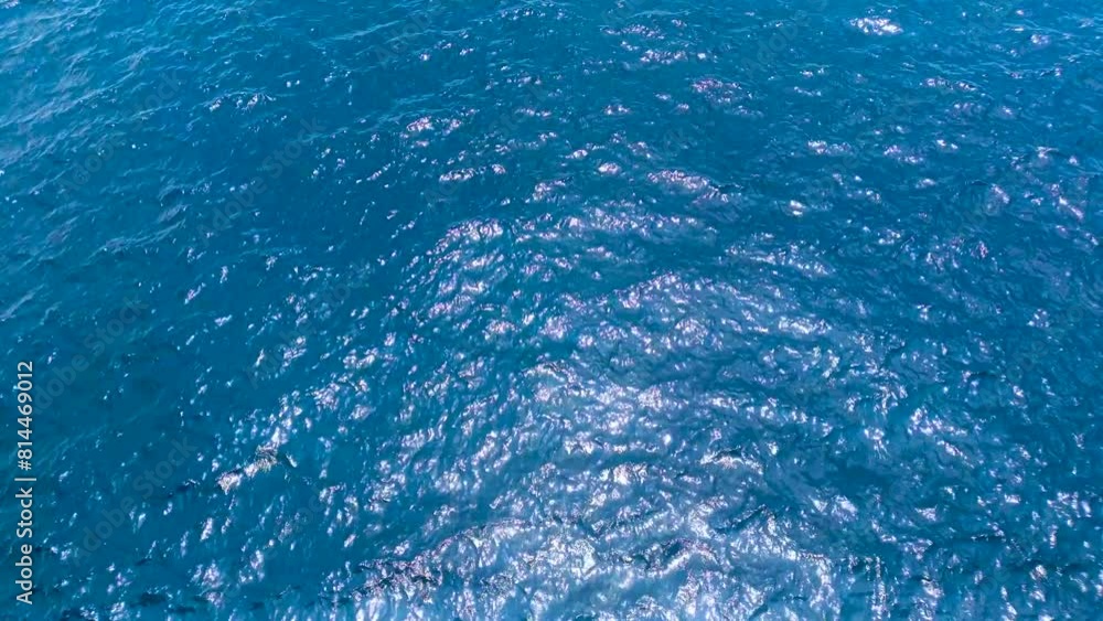 blue waters of ocean with ripples and reflection of sunlight. blue waters of ocean with ripples and reflection of sunlight.