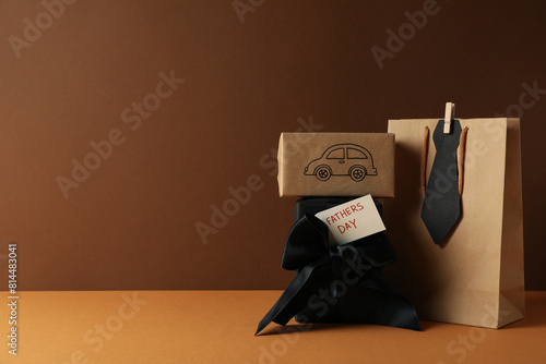 Concept of international father's day, gifts and greetings, on a brown background.