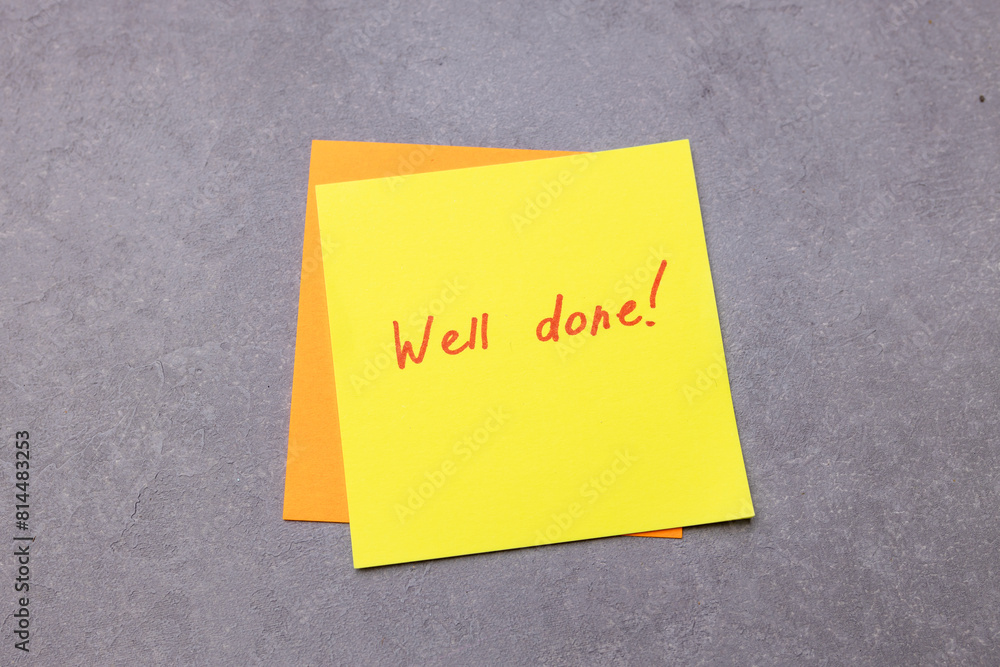 Sticker 'Well done' close-up. Concept learning english Sticker 'Well done' close-up. Concept learning english