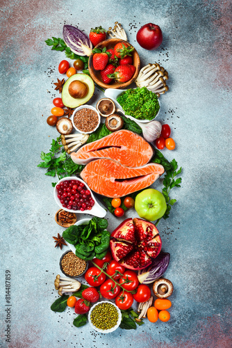 Balanced diet food background. Healthy food clean eating concept. Fish, nuts, fruits and vegetables, superfood.