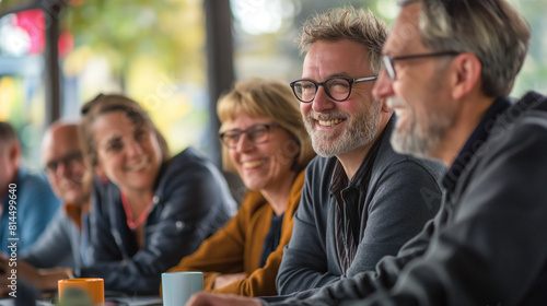 Senior Businessman Smiling at a Meeting.