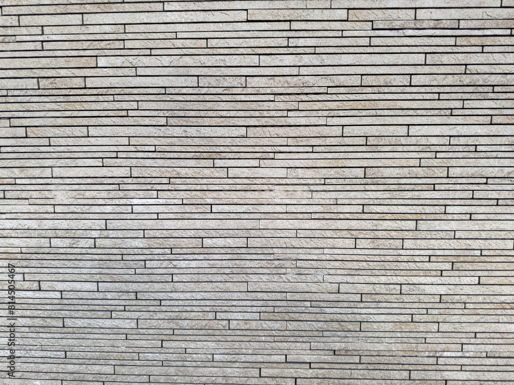 Natural decorative stone wall gray tones for use as background. Natural decorative stone wall gray tones for use as background.