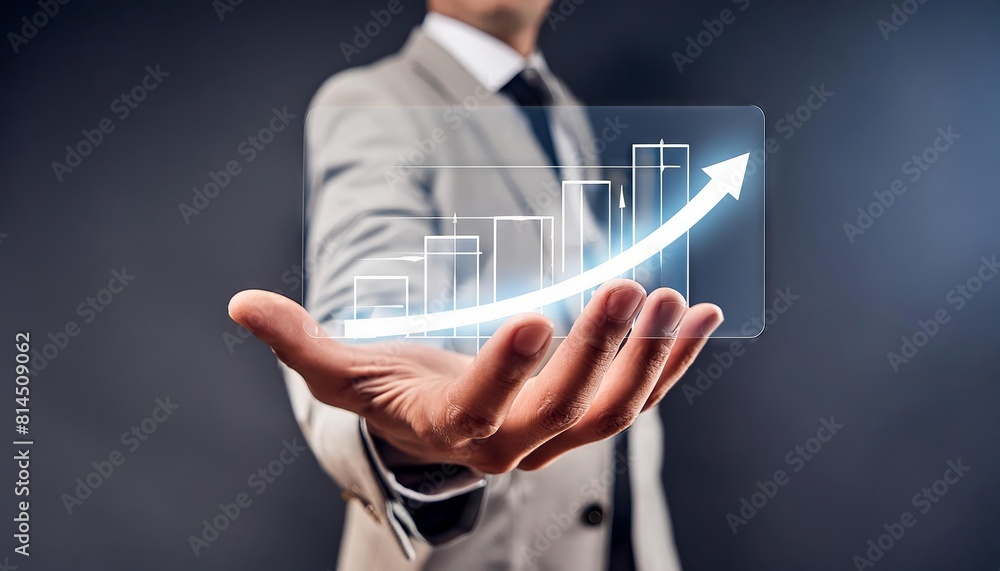 Businessman hand holding a virtual growth graph data showing investment, sales and revenue growth Businessman hand holding a virtual growth graph data showing investment, sales and revenue growth