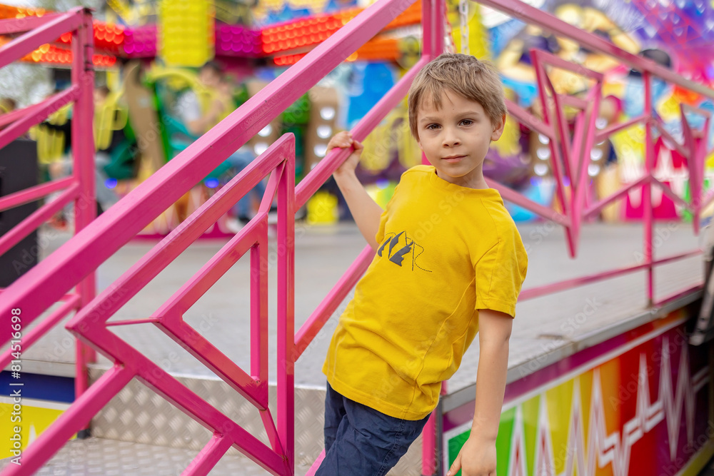 Happy children, enjoying a day in amusement park Happy children, enjoying a day in amusement park