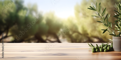 Mock up podium with green olive twig on wooden table  blurred green outdoor background 