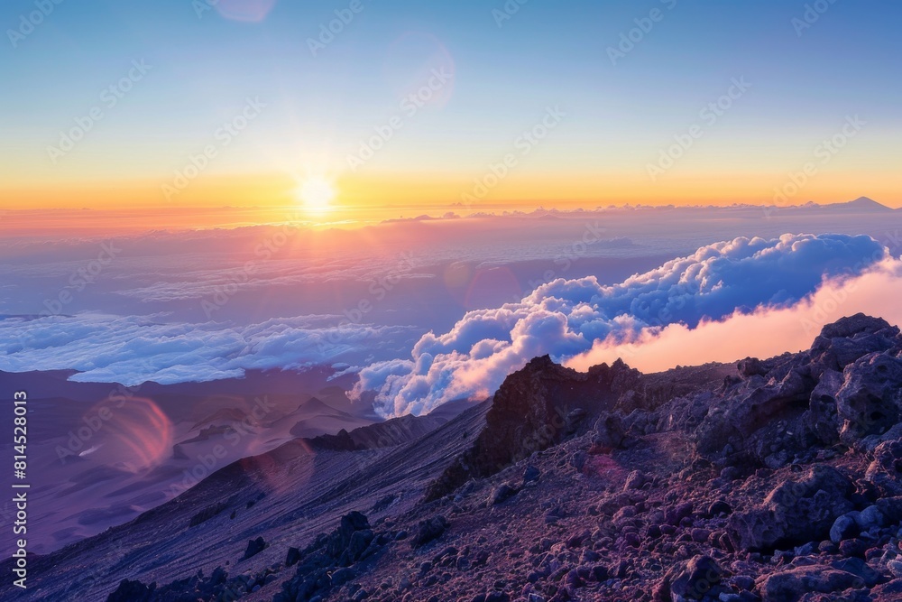 Sunset Glow on Snow-Covered Mountain Summit