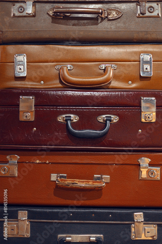 Pile of colorful vintage suitcases., stacked vintage luggage, flea market, swap meet