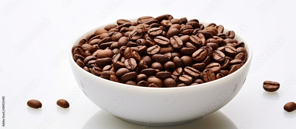 Fototapeta premium A cup of roasted coffee beans on a white background with plenty of copy space for other elements of your design