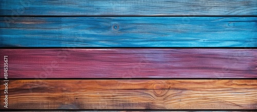 Top view of a multi colored wooden texture with ample copy space for text