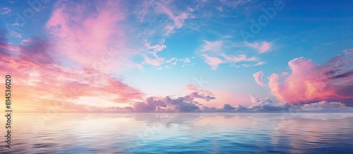 A beautiful image of the sunrise with vibrant blue and pink hues filling the dawn sky signifying the beginning of a promising day copy space image © vxnaghiyev