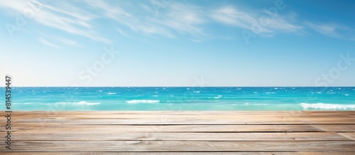 A wooden table surface placed on a serene backdrop of the summer ocean and sky creates a perfect blend It offers ample copy space for showcasing your product designs or creating montages