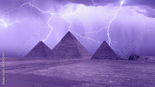 Pyramid complex of Giza at night in a thunderstorm and lightning. Giza  Cairo  Egypt