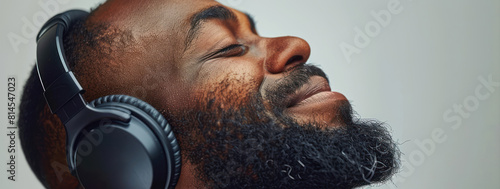 Close-up portrait of a handsome African American man wearing headphones photo