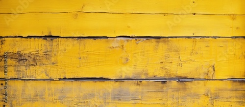 Wallpaper Mural The weathered wooden background features peeling paint in a yellow hue providing a textured and vintage appearance It offers ample copy space for text placement Torontodigital.ca