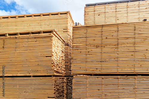 Outdoor timber warehouse with planks of wood © myphotobank.com.au