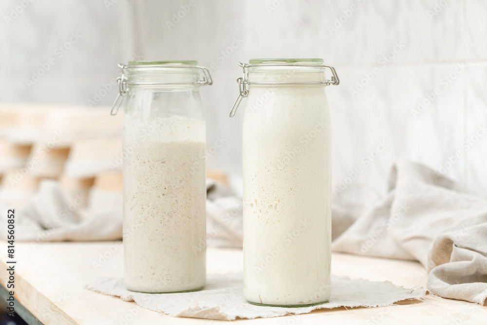 Sourdough for homemade bread in bottles on the table Sourdough for homemade bread in bottles on the table