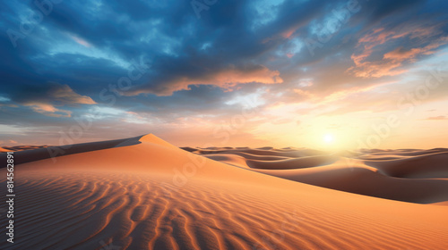 Sand dunes under sunset or sunrise glowing sky with clouds, dramatic desert landscape © dvoevnore