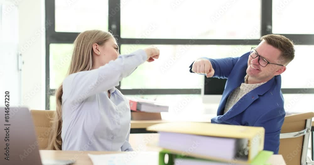 Happy business colleagues fist bumping at work in office 4k movie slow motion. Success in teamwork concept Happy business colleagues fist bumping at work in office 4k movie slow motion. Success in teamwork concept
