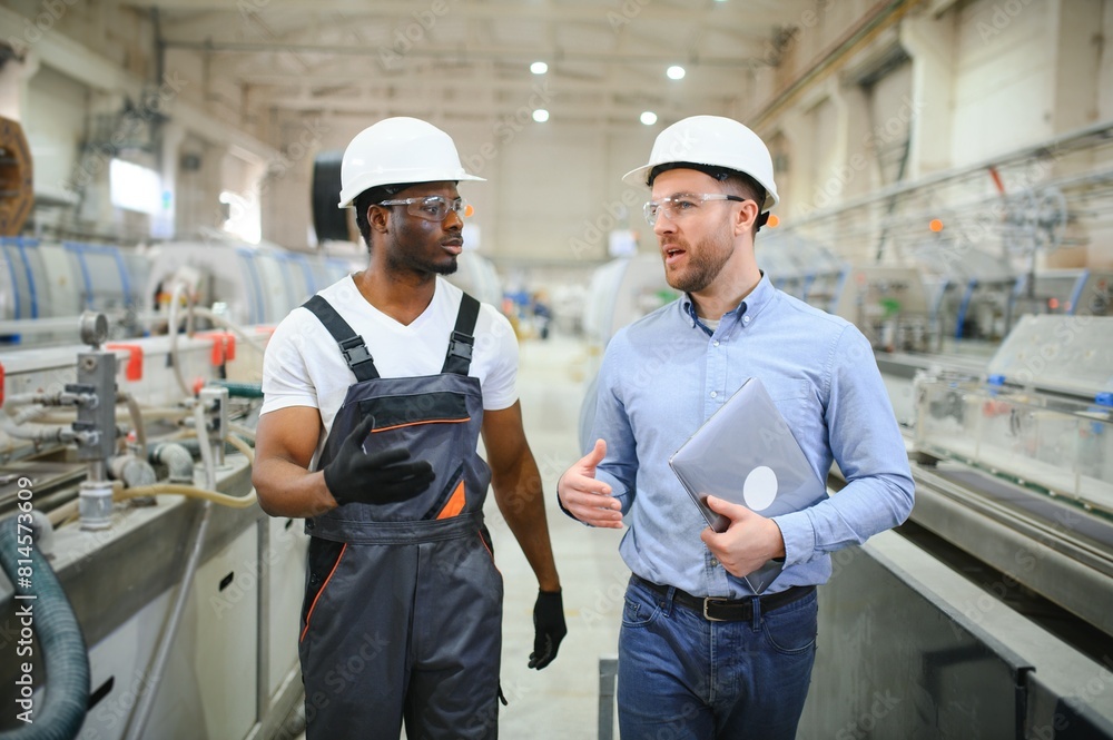 Two Heavy Industry Engineers Stand in Factory Two Heavy Industry Engineers Stand in Factory