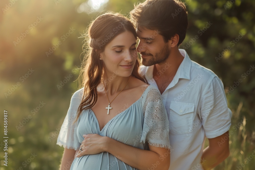 Expectant couple embraces in a sunlit field beautifully captured in a serene, natural setting Expectant couple embraces in a sunlit field beautifully captured in a serene, natural setting