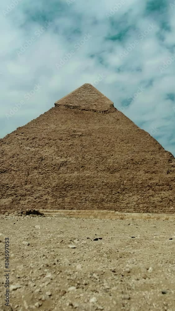 Egyptian Giza pyramid under cloudy sky Time lapse vertical video. Egyptian Giza pyramid under cloudy sky Time lapse vertical video.