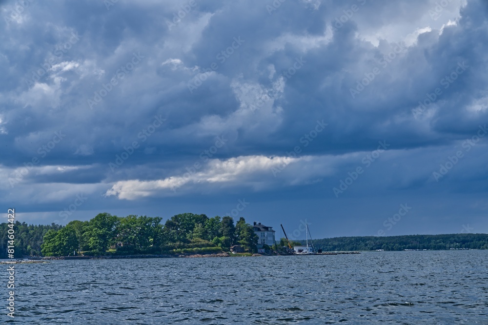there is an island with many small boats in the water there is an island with many small boats in the water