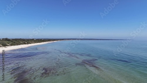 Drone footage over the sandy shoreline and scenic seascape view in Esplanade, Urangan QLD, Australia photo