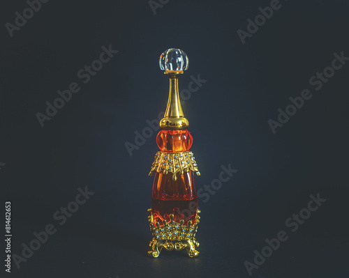 Perfumery. A bottle of oil perfume in oriental style and a glass stick for applying to the body