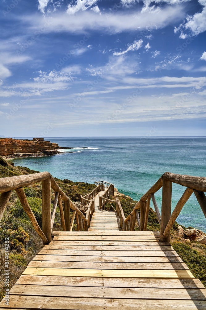 Beach staircase leading to the shoreline on the Atlantic coast in Ericeira, Portugal Beach staircase leading to the shoreline on the Atlantic coast in Ericeira, Portugal